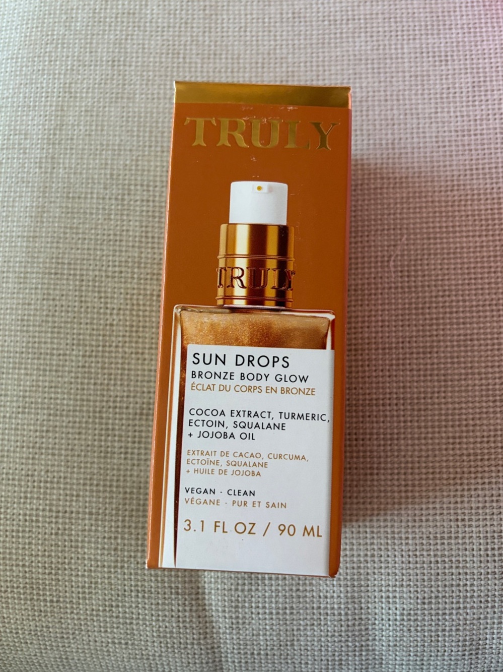 TRULY Sun Drops Bronze Body Glow - Metallic Bronze and White Packaging
